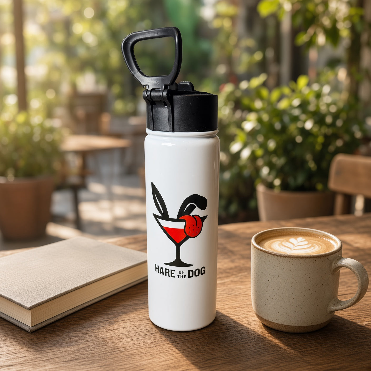 White double-sided Hare of the Dog insulated water bottle with flip-top straw lid and carry loop